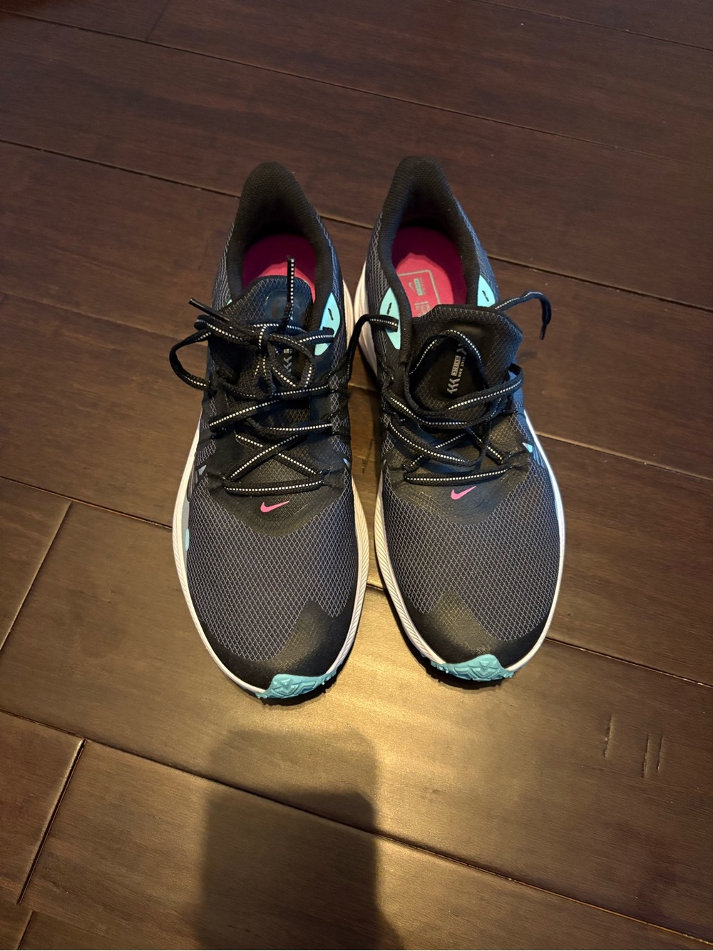 Nike Women's Dark Gray Running Shoes with Teal and Pink Accents